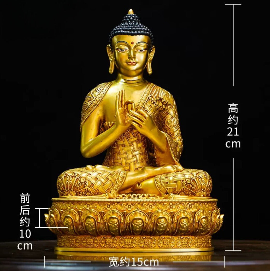 A gilded statue of Shakyamuni Buddha on the shrine at Tashi Gephelling Buddhist Centre
