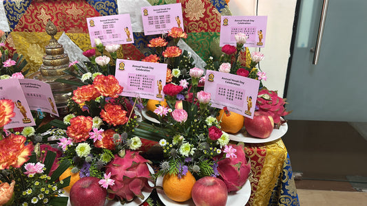 Flower offerings and dedication cards at Tashi Gephelling Buddhist Centre