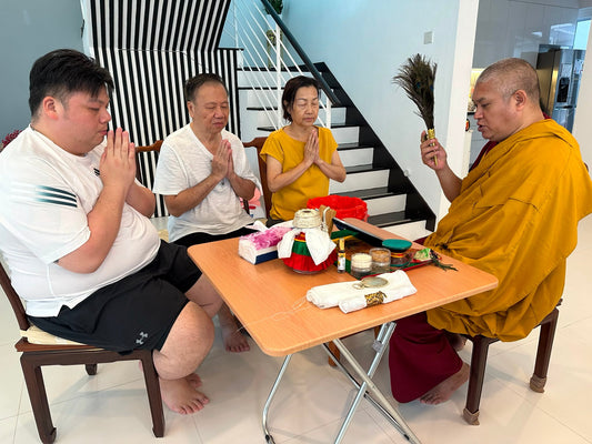 Bise Rinpoche performing a house blessing ceremony for a family at home