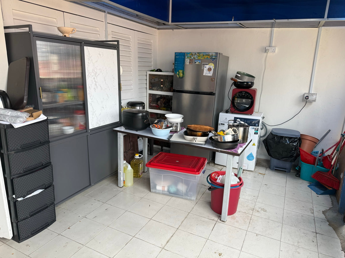 The open-air kitchen area before renovation