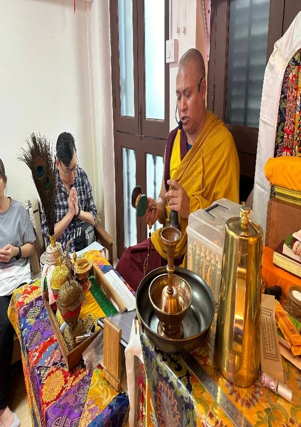 Bise Rinpoche performing a puja with students at Tashi Gephelling